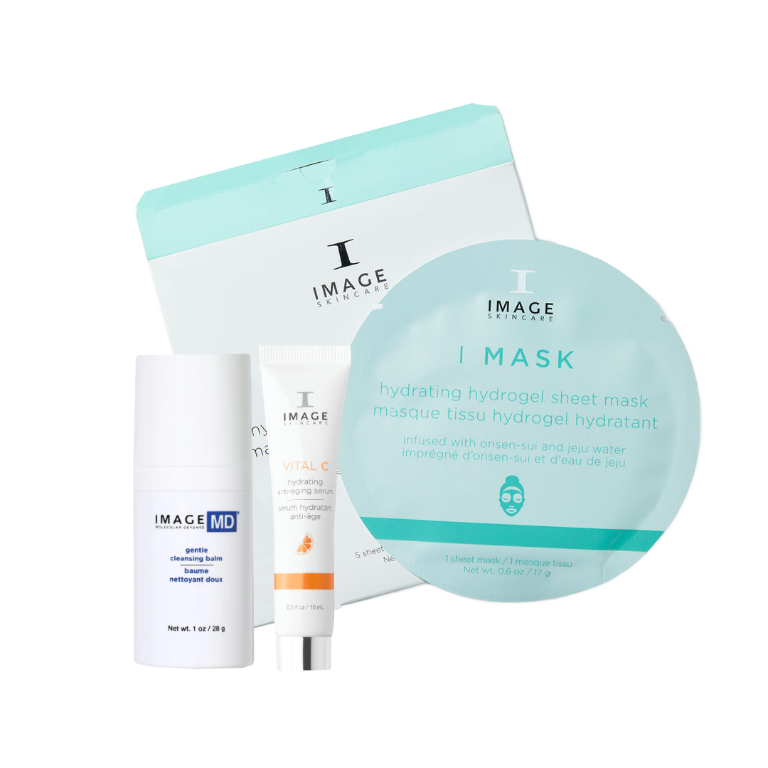 A skincare gift set from Image Skincare on a clean white background, featuring a large round sheet mask, a tube of Vital C serum, a bottle of Gentle Cleansing Balm, and a matching gift box.