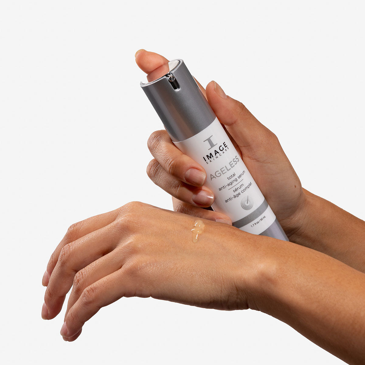 Person applying IMAGE Skincare Ageless Total Anti-Ageing Serum on the back of their hand.